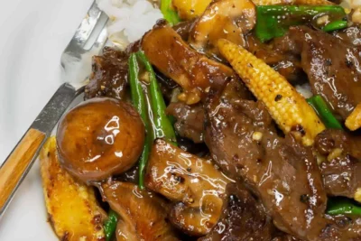 Salteado de ternera con champiñones y maíz tierno